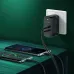 LDNIO Q367 wall charger powering two smartphones via USB-C fast charging ports, sleek black body and LED indicator