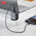 Lifestyle view of the XO L152 EU 18W Fast Charger Adapter with Lightning Cable connected to a smartphone on a desk