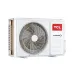Outdoor view of TCL 2 Ton Inverter AC compressor unit with large fan grille, side vents, and red TCL inverter branding.