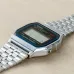 Casio A159WA-N1DF Vintage Digital Chain Watch placed on wooden surface showing digital face and bracelet