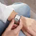 Close-up wrist view of Casio AQ-230A-7DMQ Watch with analog hands and digital screen, hand adjusting time indoors.
