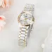 Flat lay of Casio LTP-1183G-7ADF Watch on soft white surface with polished silver-gold band and floral background.