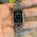 Handheld view of Casio LTP-1234DD-1ADF Watch with rectangular black dial, silver markers, and polished metal band.