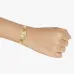 The Casio LTP-1234LL-7ADF Watch displayed on a wrist, highlighting its compact size and elegant gold-tone design.