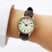 Wrist view of Casio LTP-V005GL-9AUDF Watch with gold case, white dial, and brown textured leather strap.