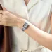 Distant wrist viewpoint of the Casio LTP-V007D-7BUDF Ladies Chain Watch worn with an elegant white dress.