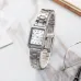 Front view of Casio LTP-V007D-7EUDF Ladies Chain Watch on marble surface beside eyeglasses and papers.