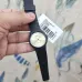 Handheld view of Casio MQ-24-9ELDF Analog Watch with gold dial and product tag attached to strap.