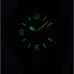 Glow-in-dark view of Casio MRW-200H-1B2VDF Analog Watch showing luminous numerals and hands at night.