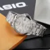 Front view of Casio MTP-V004D-7B2UDF Watch with silver dial, bold numerals, and stainless steel band on display surface.