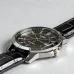 Casio MTP-V004L-1CUDF Watch shown in an angled side profile highlighting the black dial, leather strap, and polished case.