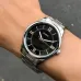 Wrist view of Casio MTP-V005D-1B5UDF Analog Watch with silver band and black dial worn against denim clothing.