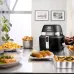 Delonghi FH2394.BK 1.5L Multi Cooker IdealFry Digital Air Fryer on kitchen counter surrounded by cooked dishes