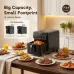 Kitchen view of Oraimo Intellifry Air Fryer cooking roasted chicken with plates of food around on dining table.