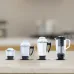 Display of Tefal Apexgrind Plus Mixer Grinder jars in varying sizes with metallic and transparent designs on kitchen counter.