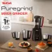 Kitchen display of Tefal Puregrind Mixer Grinder with transparent jar and three stainless steel jars beside spices and fruits.