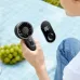 Close usage view of Aecooly PE01 Halo 03 Handheld Portable Fan showing fan head and portable remote control unit