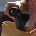 Close-up view of Aecooly PF04 AirGimbal Handheld Turbo Jet Force Fan being placed into bag showing compact portable design
