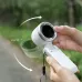 Outdoor wrist view of Portable Mini Turbo Fan in white body with rotating head tilting about 180 degrees.