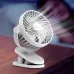 Angled close-up view of Yison Celebrat F4 Clip-on Portable Fan showing active airflow and clip-on base.