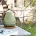 Delonghi KBOV2001.GR 1.7L Icona Vintage Electric Kettle placed outdoors on table with rustic background