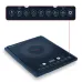 Kitchen use view of Tefal EXPRESS IH 1600W Induction Cooker with frying pan stir-fry and digital touch controls.
