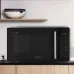 A black Whirlpool Magicook Pro 25GE microwave oven with its door open, revealing a dish of lasagna and a digital display showing 