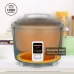 Front view of Panasonic SR-Y18G Rice Cooker with overlapping heater glowing orange and keep warm indicator.