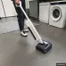 Upright Xiaomi Truclean W30 Pro Wet Dry Vacuum Cleaner in use on smooth floor near washing machine in utility room.