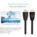 Front view of DTECH DT-H008 10M HDMI Cable with gold-plated tips beside TV showing 4K ballerina scene.