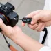 Side perspective view showing hands attaching quick-release buckle of K&F Concept KF13.1005 Camera Strap.