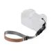 Angled studio view showing K&F Concept KF13.116 Camera Wrist Strap attached to a camera body.