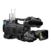 Angled view of the black JVC GY-HC900C20 broadcast camcorder with a zoom lens and accessories.