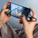 Close-up of a person gaming on a smartphone, using the BWOO BZ-47 USB-C to 3.5mm audio adapter for headphones.