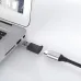 Close-up of the black ONTEN OTN-5311T adapter's USB-A plug inserted into a laptop.