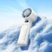 Lifestyle view of Hoco HX603 portable handheld fan standing on a snowy outdoor surface.