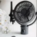 Black Solove F12 portable desk fan with adjustable tilt, front grill design, placed on a table in a minimal indoor setup