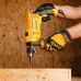 Work view of INGCO ID8108 Drill Machine boring hole into wood surface with protective gloves and multiple drilled points.