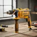 Workshop view of INGCO ID9008 Drill Machine on wooden bench with side handle, depth gauge, and scattered tools.