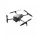 Angled view of DJI Mini 5 Pro in flight-ready position with orange-tipped propellers and front-mounted gimbal camera.