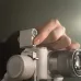 Side view of DJI RS Intelligent Tracking Module with illuminated tracking sensor mounted on a gimbal.
