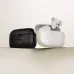 Black and white Havit TW992 earbuds shown side by side with their charging cases on a flat surface.