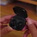 Close handheld view of Samsung Galaxy Buds Core in black showing open charging case with earbuds inside
