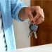 Hand holding keys with UGREEN smart tracker, portable key finder for easy tracking and everyday use
