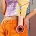 Lifestyle view of the Jisulife Life4 Mini Handheld Fan in pink hanging from a strap on casual outdoor clothing.