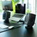 ADAM Audio D3V Active Type‑C Studio Monitor Speakers placed on a desk beside a laptop in a modern workspace setup.