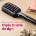 Angled top view of the Philips BHH880 Hair Straightener brush head resting on a wooden surface.