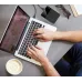 Lifestyle view of the Toshiba Canvio Ready 4TB USB 3.2 External HDD connected beside a laptop on a desk workspace