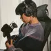 Lifestyle view of Audio Technica ATH-R30x Studio Headphone worn while playing guitar in indoor setting.