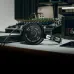 Desk view of Audio Technica ATH-R30x Studio Headphone with open-back mesh grille beside audio mixing console.
